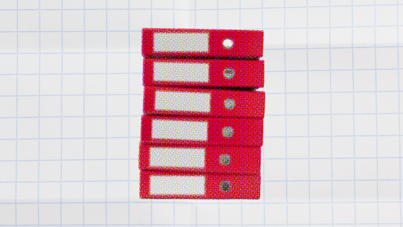 stack of binders on a white background for capacity planning vs resource planning