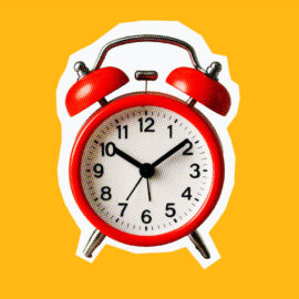alarm clock on an orange background for task-oriented leadership