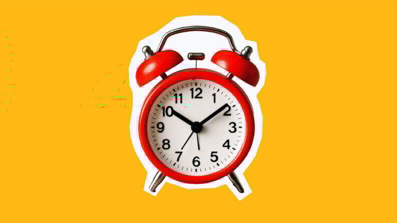 alarm clock on an orange background for task-oriented leadership