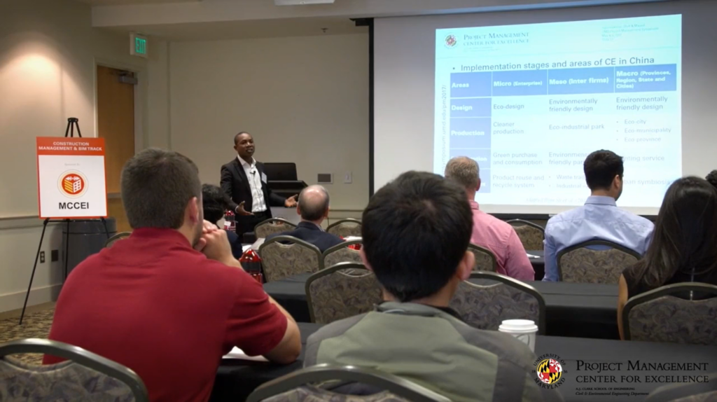 Speaker presenting at the Project Management Symposium 2025