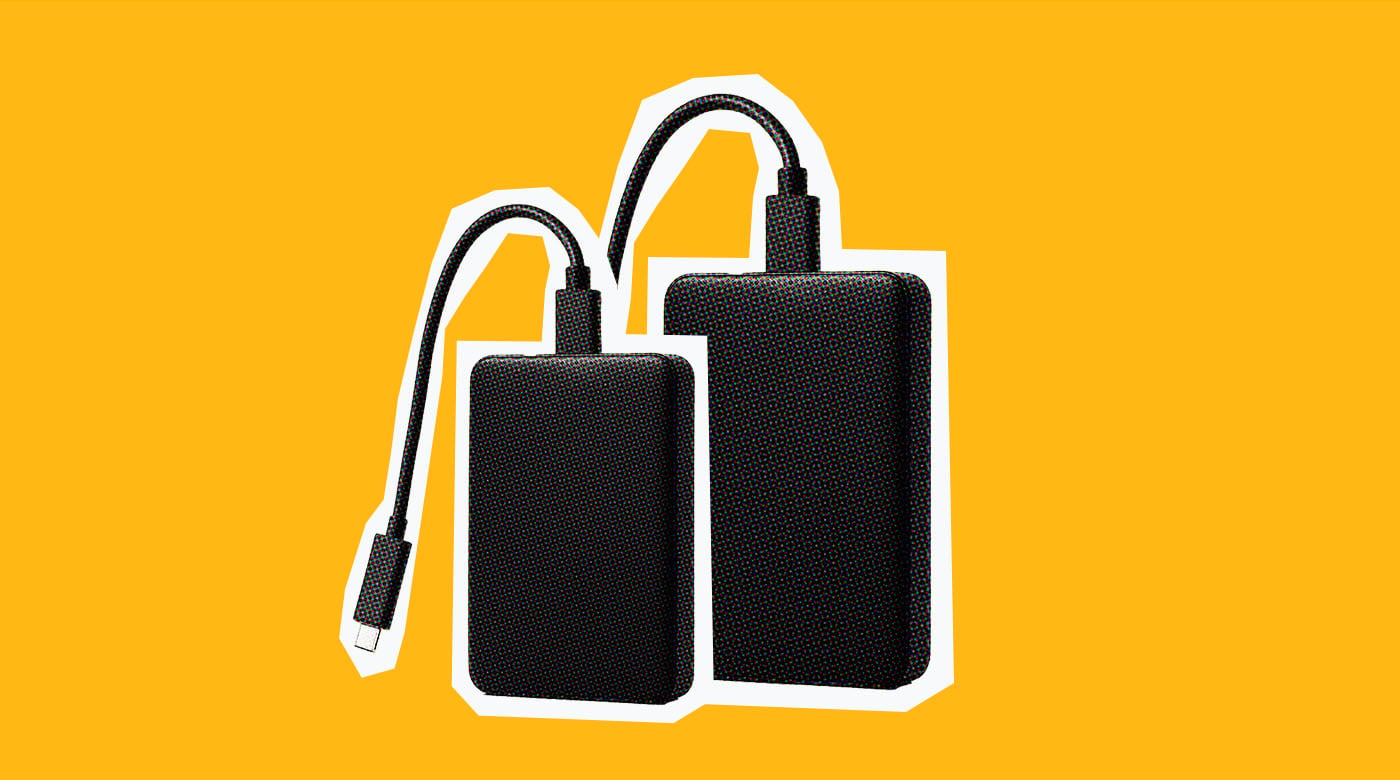 image of two hard drives on an orange background for digital asset management workflow